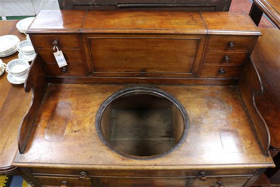 A Regency mahogany washstand with cistern compartment and basin recess W.94cm.